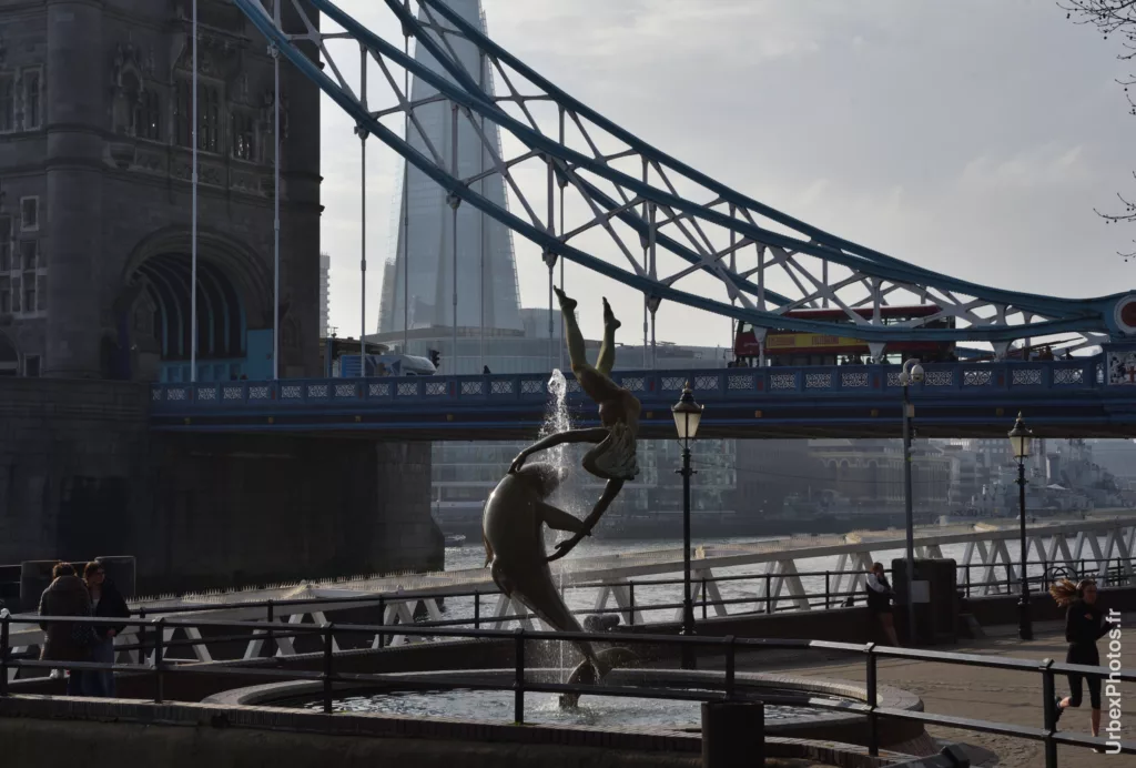 Girl with a dolphin, Tower Bridge, London